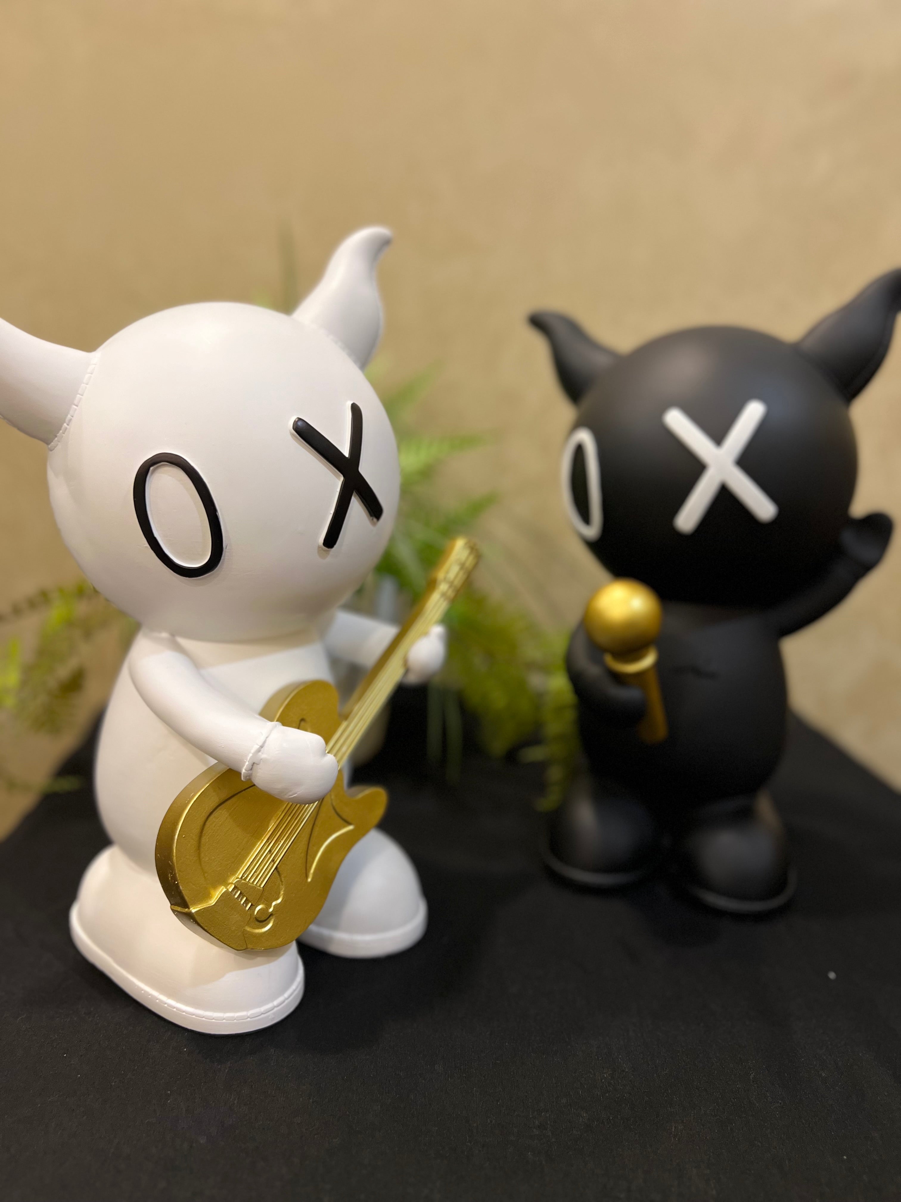 Guitar and Mic Rabbit Sculptures